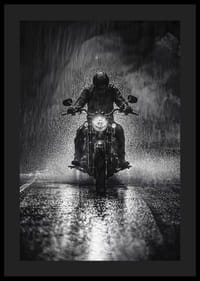 Bold motorcyclist braves the rain in dramatic scene-0