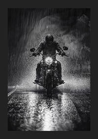 Bold motorcyclist braves the rain in dramatic scene-1