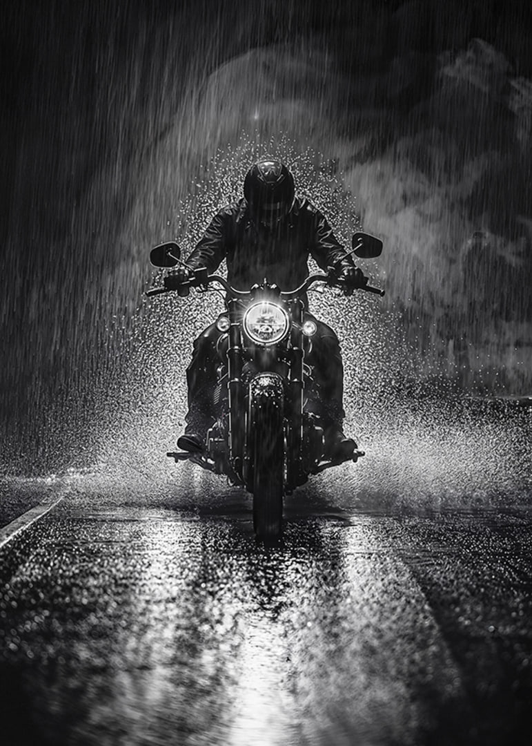 Bold motorcyclist braves the rain in dramatic scene-12