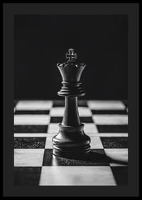 A chess king stands majestically on the board in intense light-4