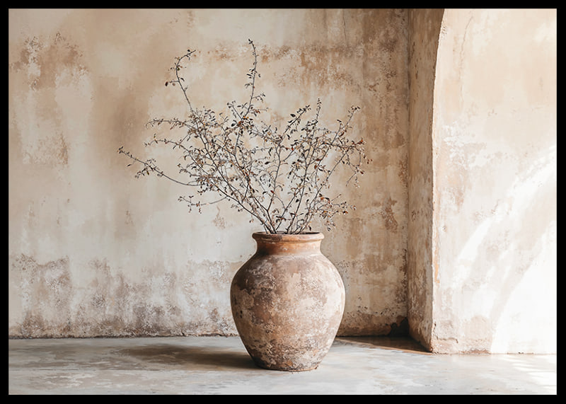 A rustic pot with twigs against a softly patinated wall-12