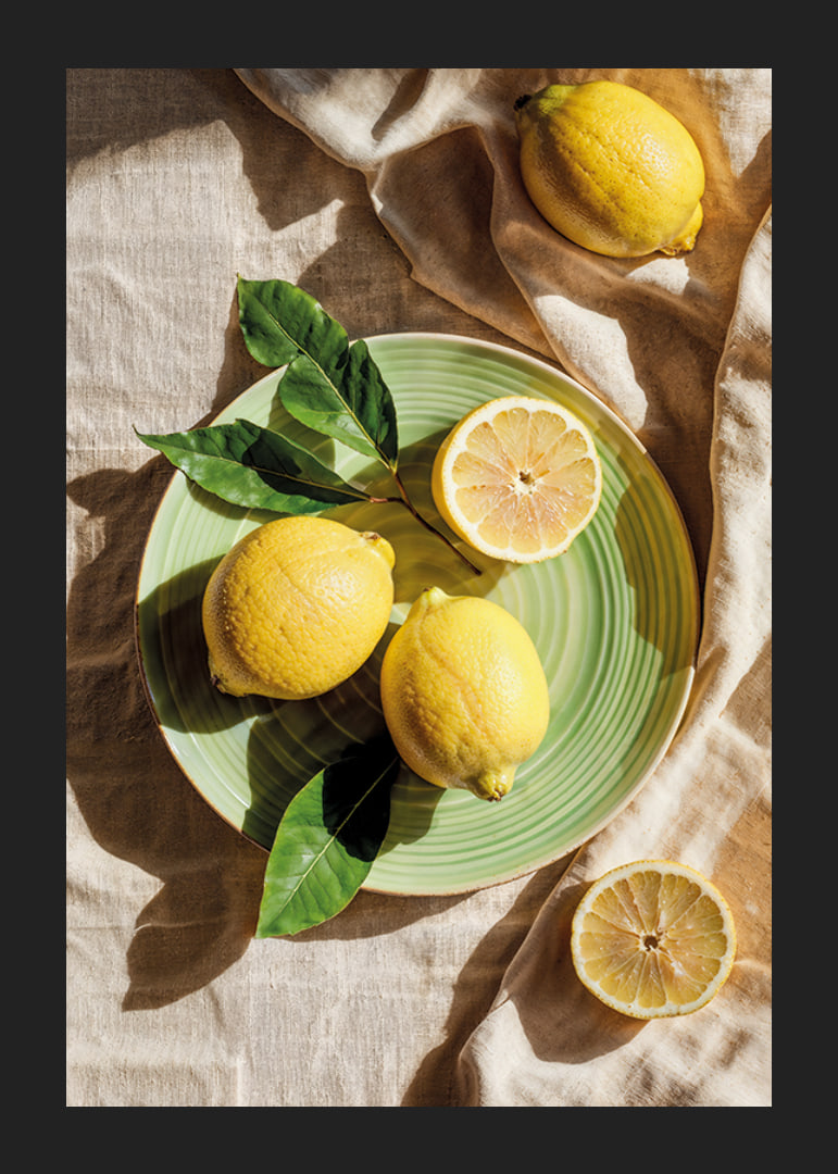 Vibrant lemons on a green plate in a sunny setting-12