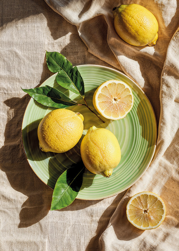 Vibrant lemons on a green plate in a sunny setting-12