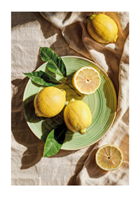 Vibrant lemons on a green plate in a sunny setting-1