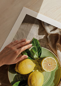 Vibrant lemons on a green plate in a sunny setting-9