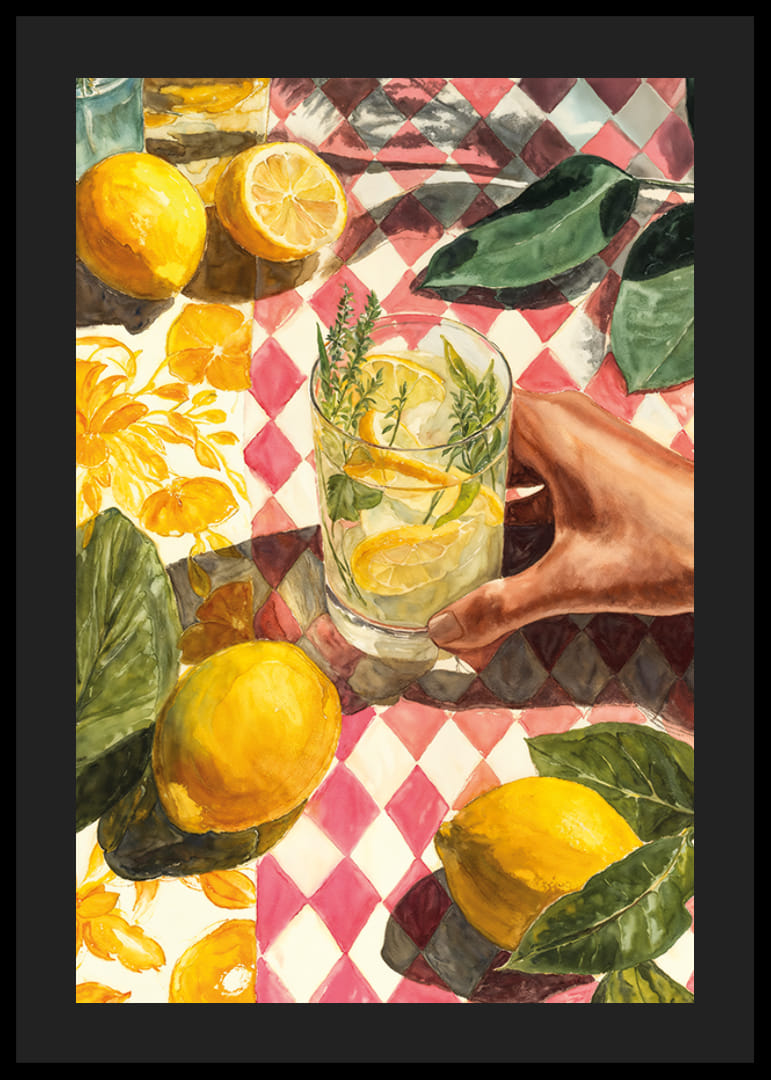 A hand enjoying a fresh lemon drink on a colorful table-12
