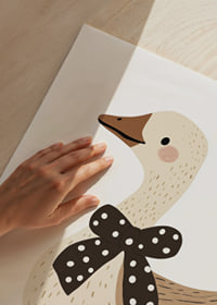 The goose with a polka dot bow exudes charm and joy.-9