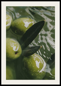 The olives float peacefully in a sea of green light.-2