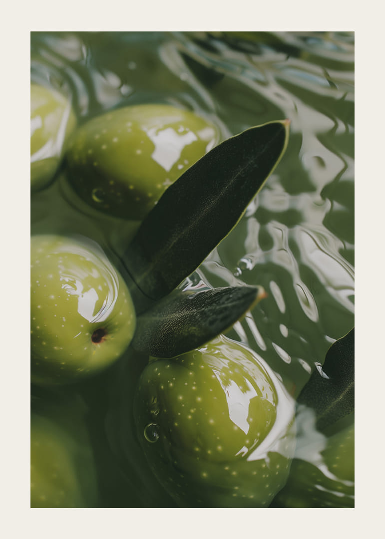 The olives float peacefully in a sea of green light.-12