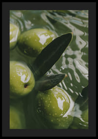 The olives float peacefully in a sea of green light.-4