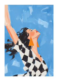 A woman reaches towards the sky in a sense of freedom.-1