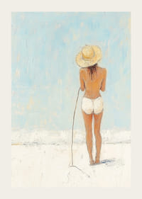 A woman stands on the beach and looks out over the sea.-3