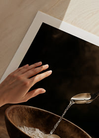 Elegant liquid poured into a rustic bowl, creating a peaceful atmosphere.-9