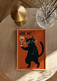 Mischievous black cat toasts with a glass of wine.-8