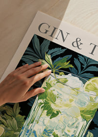 Fresh gin and tonic with lime slices in a green forest theme.-3