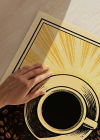 A cup of coffee surrounded by bright sun and coffee beans.-3