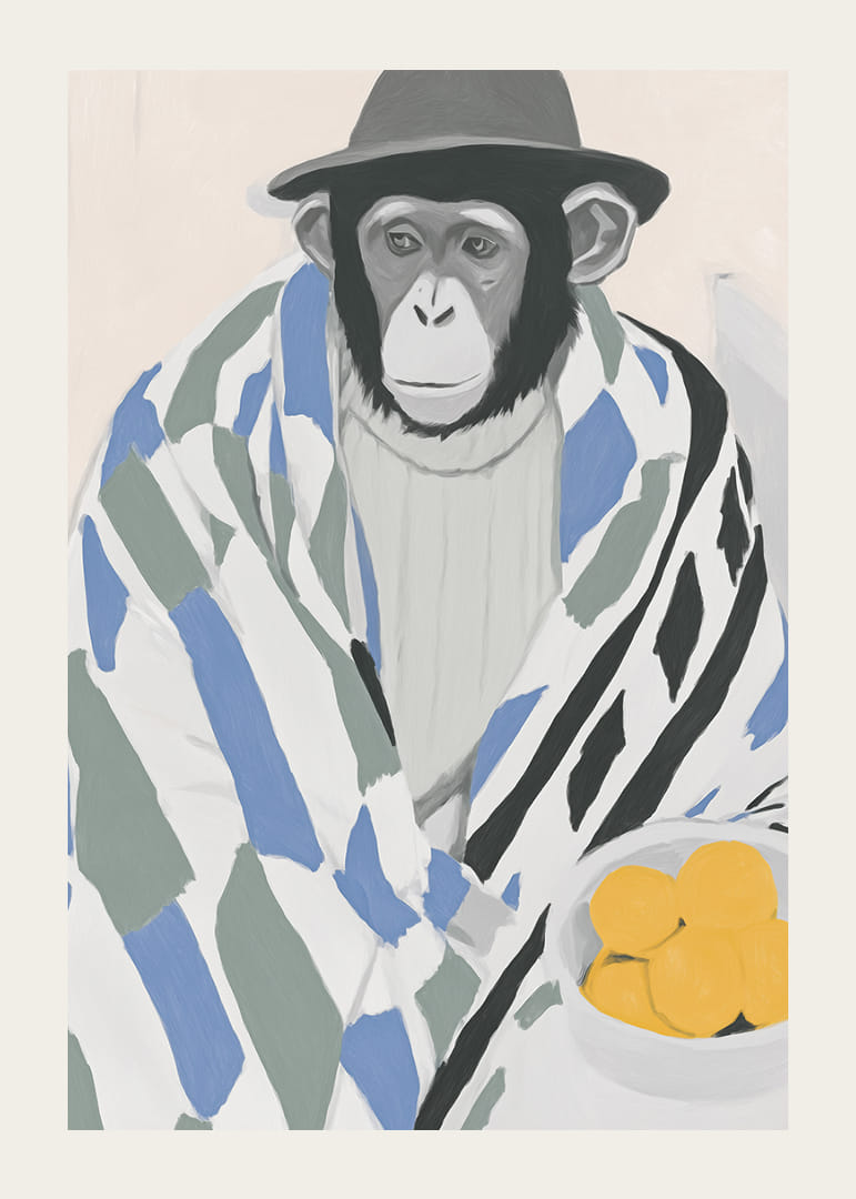 Un mono pensativo envuelto en una manta estampada con un tazón de limón.-12