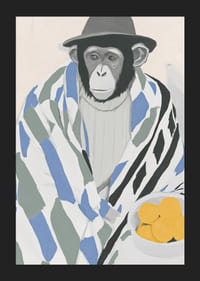 Un mono pensativo envuelto en una manta estampada con un tazón de limón.-5