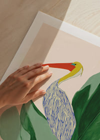 A tropical motif with a pelican and large green leaves.-9
