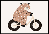 A spotted bear rides a bike with joy and charm.-6