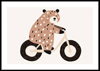 A spotted bear rides a bike with joy and charm.-0
