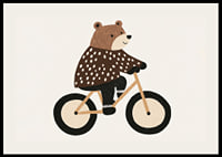 Charmig björn på cykel sprider glädje och fantasi.-2
