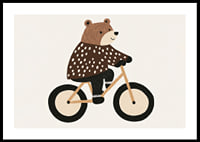 Charmig björn på cykel sprider glädje och fantasi.-0