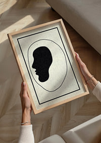 A minimalist silhouette speaks calmly to the room.-2