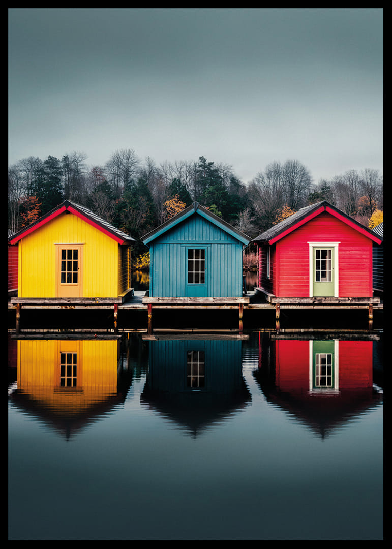 Three colorful houses are reflected in calm water, creating harmony.-12