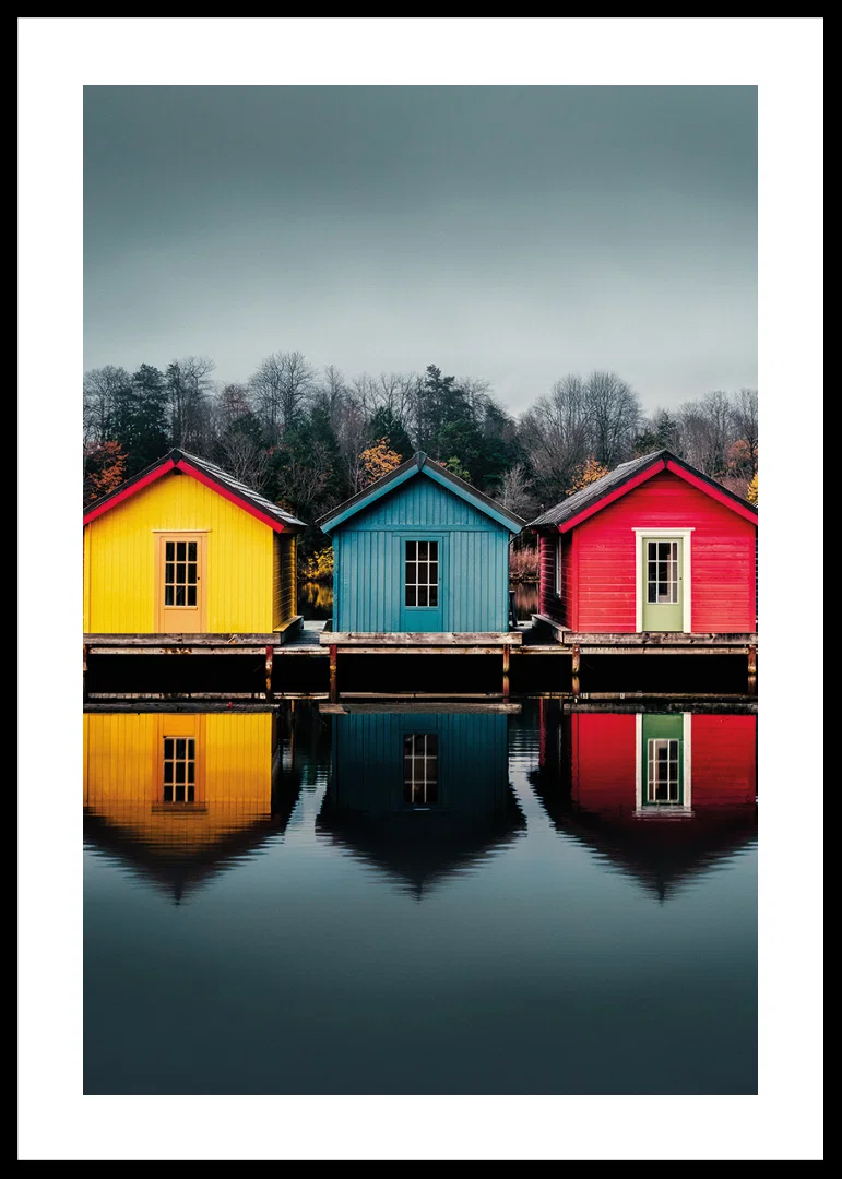 Three colorful houses are reflected in calm water, creating harmony.-12