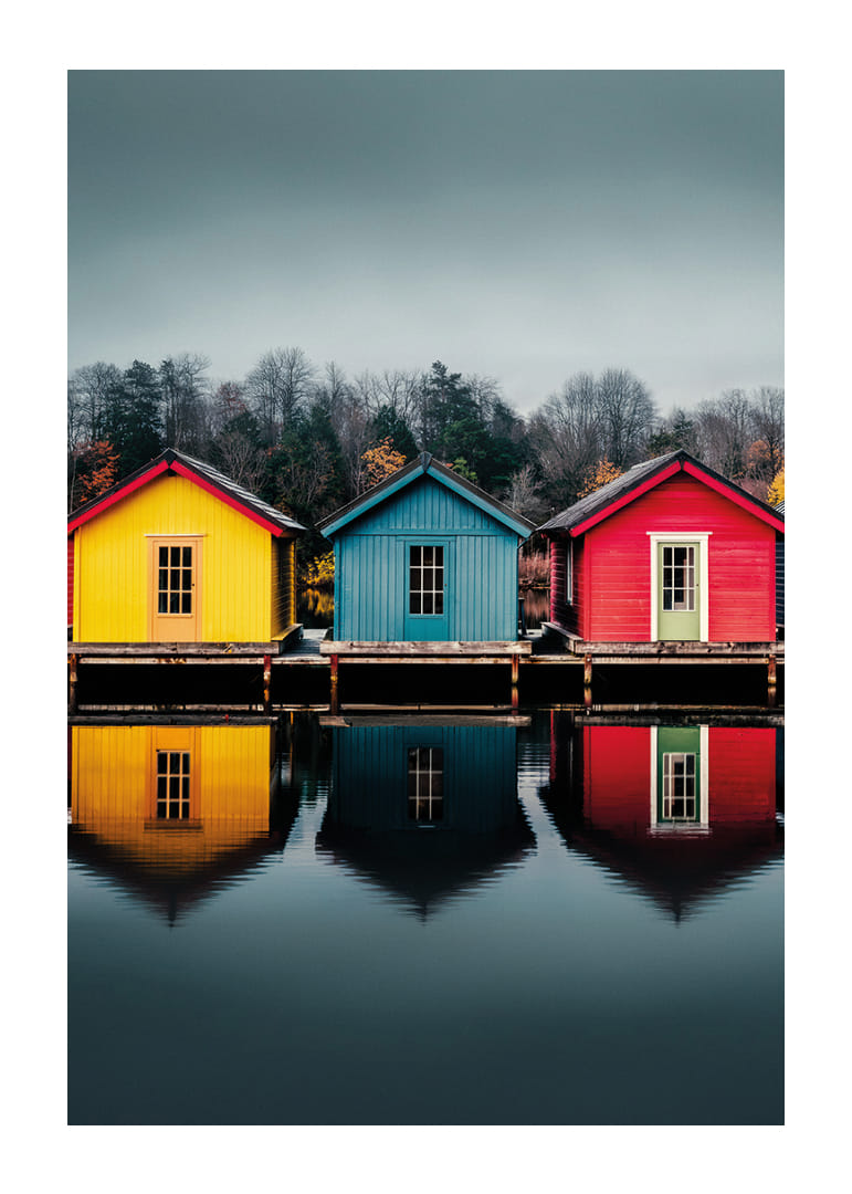 Three colorful houses are reflected in calm water, creating harmony.-12