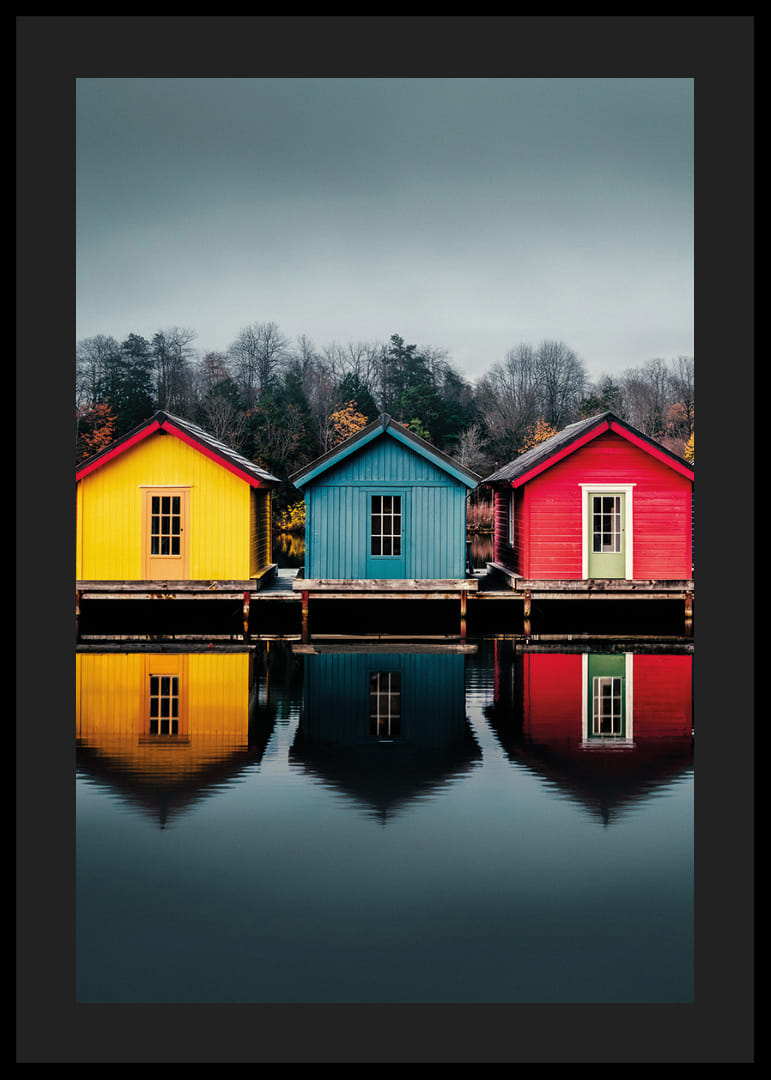 Three colorful houses are reflected in calm water, creating harmony.-12