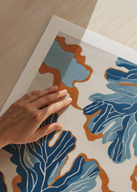 Dynamic blue patterns dance across a warm background.-9