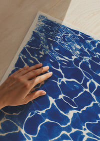 Blue waves create a calm water pattern.-3