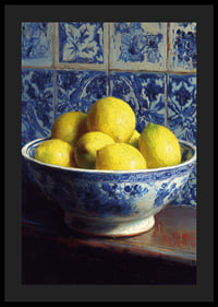 Fresh lemons in a blue and white bowl against tiled walls.-4