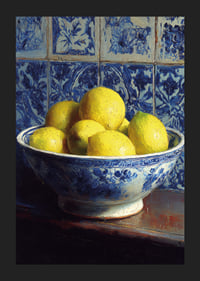 Fresh lemons in a blue and white bowl against tiled walls.-5