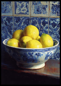 Fresh lemons in a blue and white bowl against tiled walls.-6