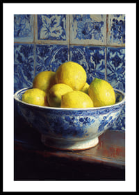 Fresh lemons in a blue and white bowl against tiled walls.-0