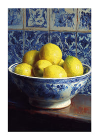 Fresh lemons in a blue and white bowl against tiled walls.-1
