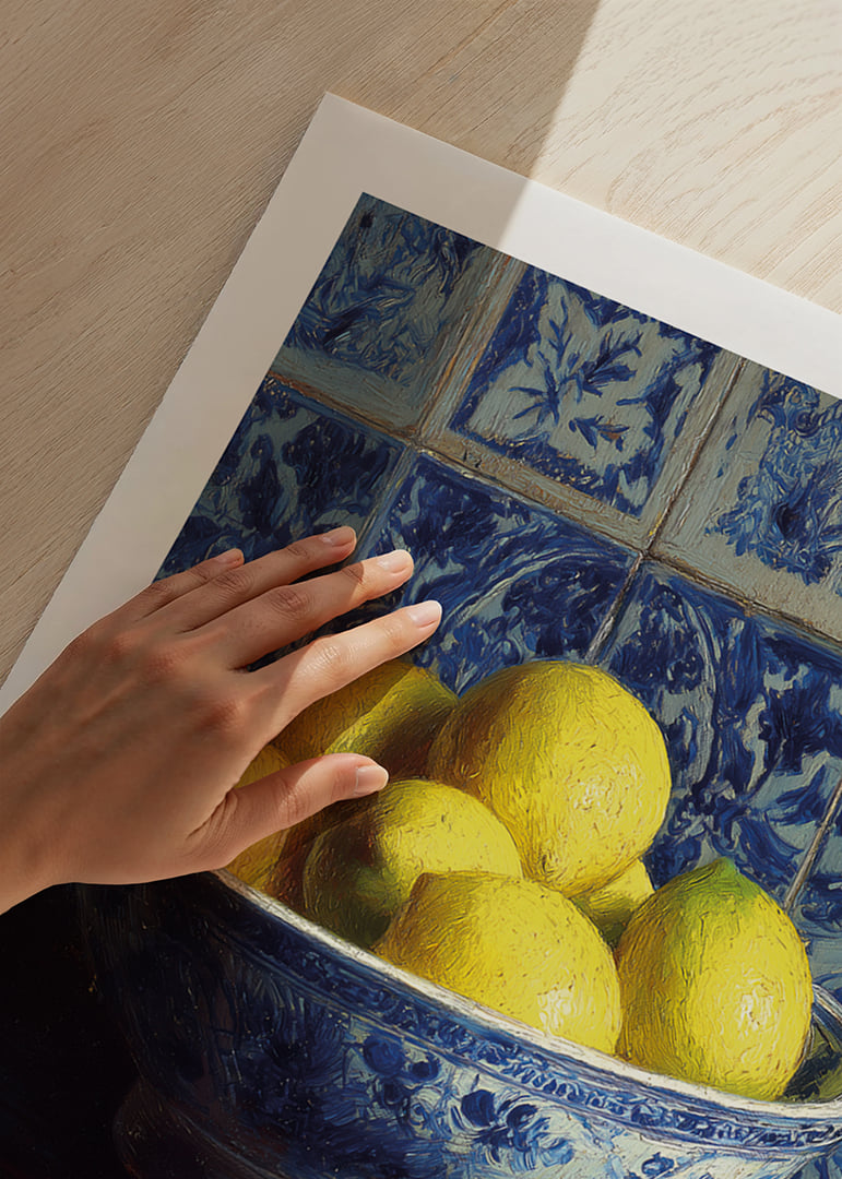 Fresh lemons in a blue and white bowl against tiled walls.-12