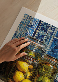 Sunny lemons in jars against blue tile wall.-9