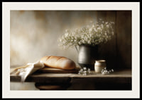 A harmonious still life with bread and flowers in soft light.-2