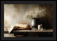A harmonious still life with bread and flowers in soft light.-4