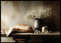 A harmonious still life with bread and flowers in soft light.-6