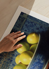 Colorful lemons in a classic bowl spread freshness.-9
