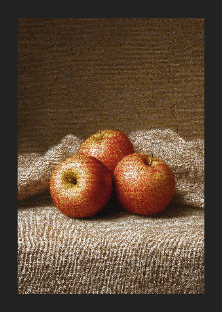 Three golden apples rest on a soft cloth.-12