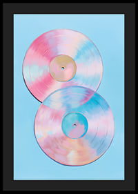 Two shimmering vinyl records in pastel tones against a blue background.-4