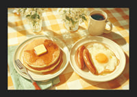 A sunny breakfast of pancakes and eggs in a warm atmosphere.-5