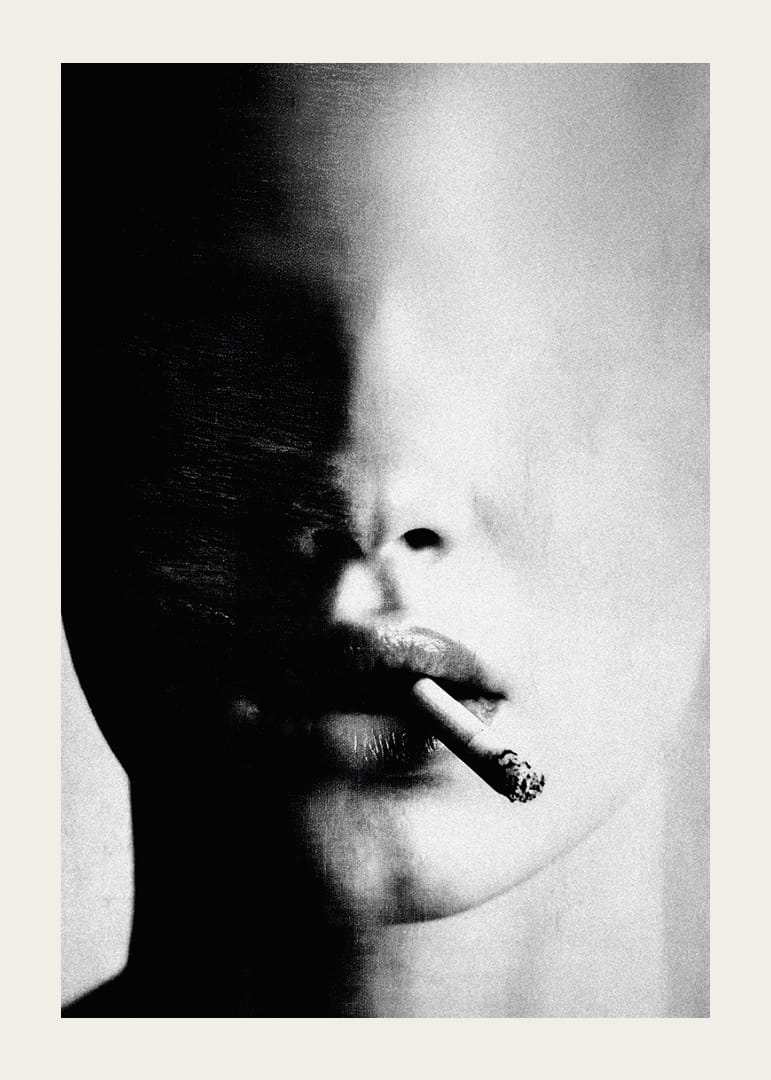 A mysterious face partially hidden in the shadows with a cigarette-12