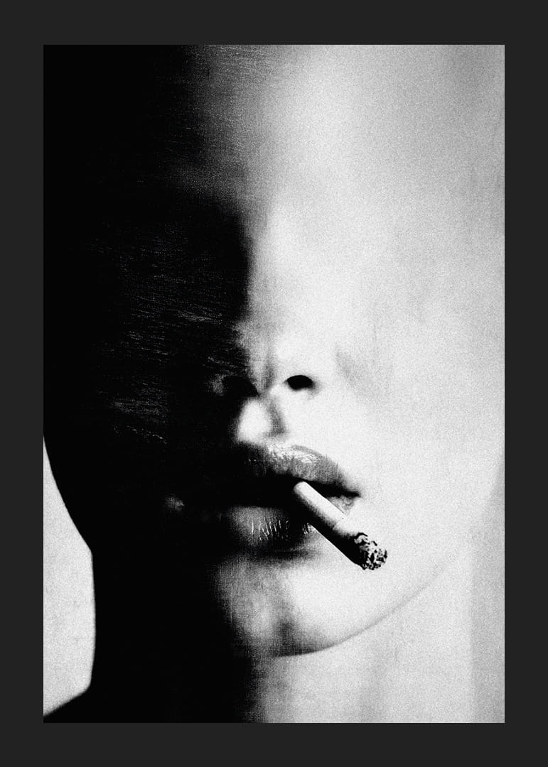 A mysterious face partially hidden in the shadows with a cigarette-12